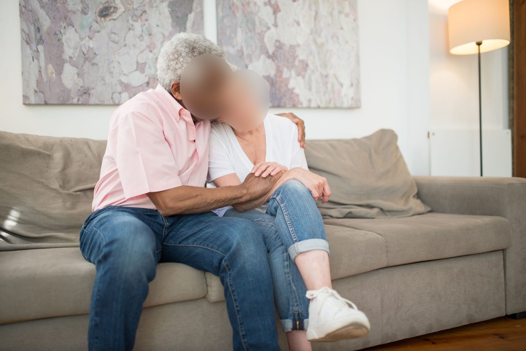 The same living room still with callouts: Emily's face blurred and name-tagged, and the TV automatically obscured