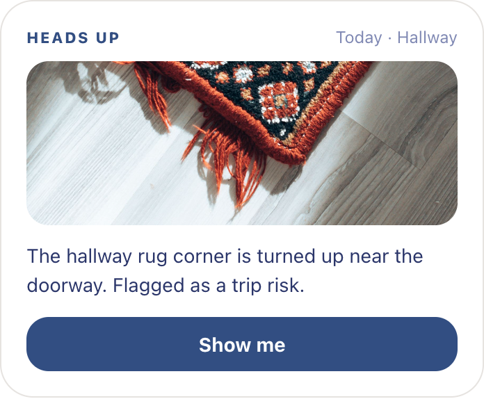 Remy heads-up card: the hallway rug corner is turned up near the doorway, flagged as a trip risk